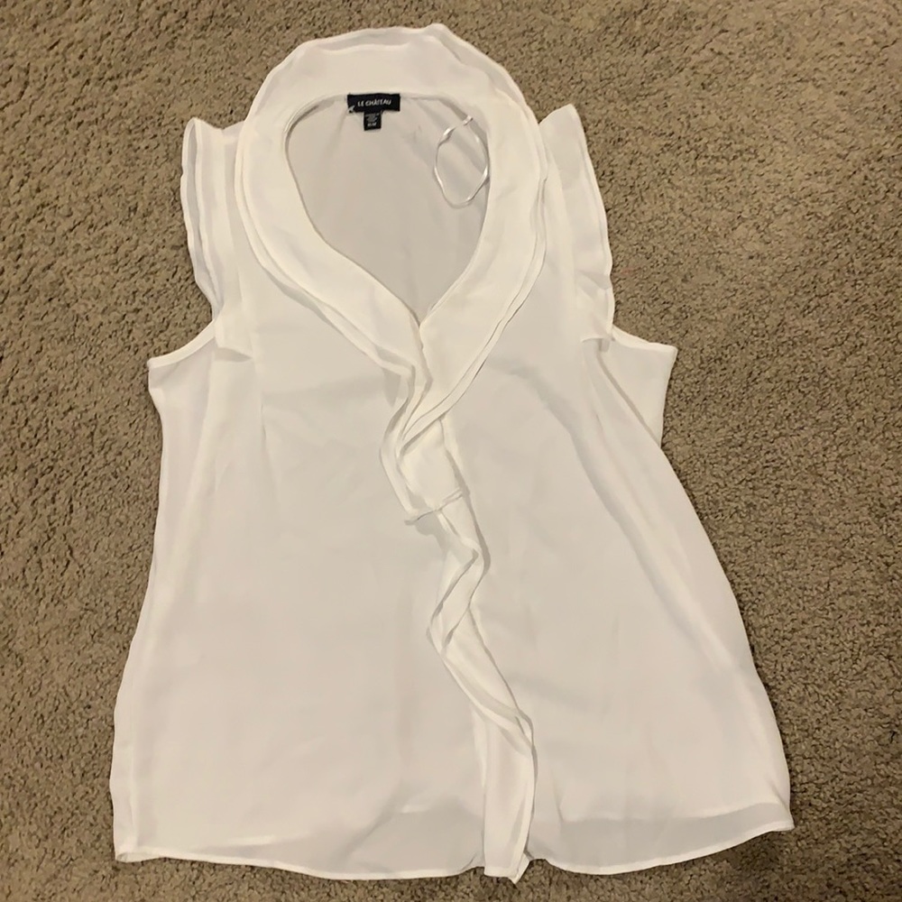 White shell top ruffle front
